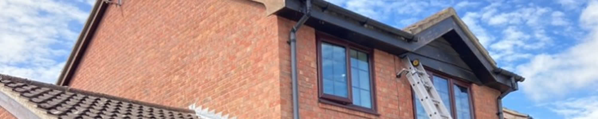 Front and Back Timber Replacement with Black UPVC for a Residential Property