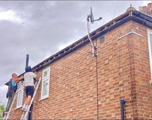 Old timber fascia boards being removed ready for replacement in Newmarket Road Cambridge
