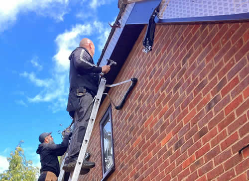 Rosewood uPVC fascias, soffits and gable ends fitted in Impington with brown guttering and new downpipes