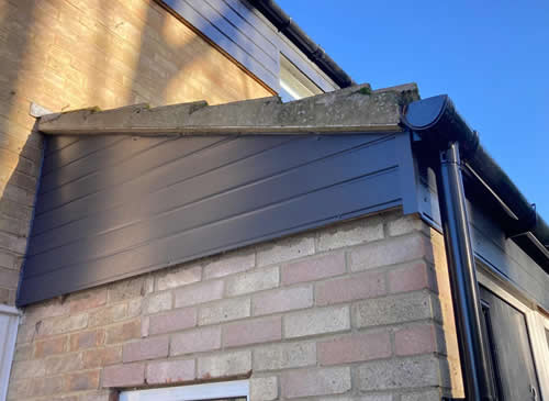 We replaced old shiplap cladding with anthracite grey uPVC shiplap and fitted new black guttering in Histon Cambridge